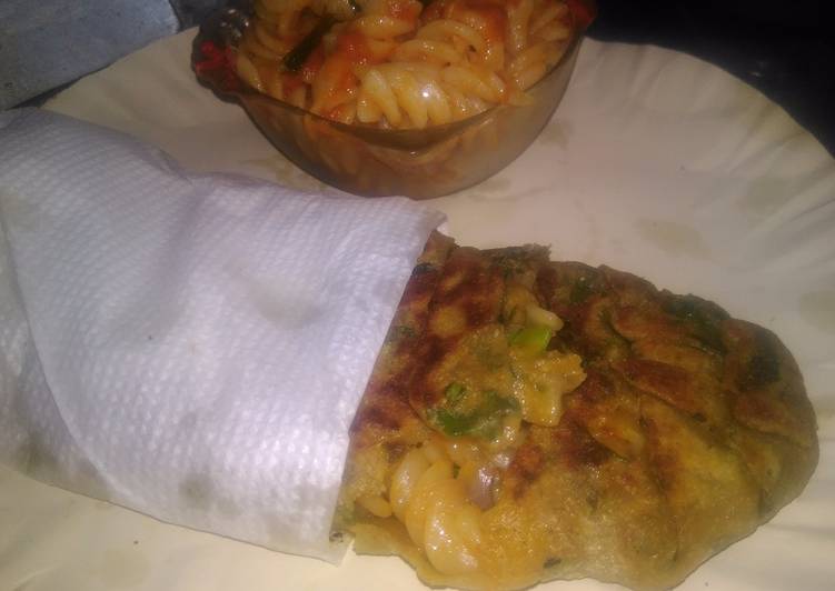 Spinach kathi roll in fishbone wrap with red souce pasta