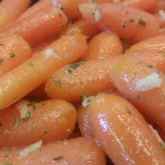 A picture of Buttered Carrots w/ Ginger & Rosemary.