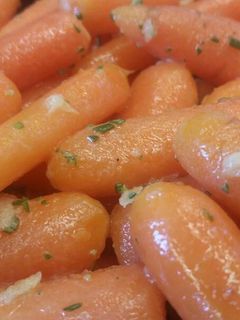 A picture of Buttered Carrots w/ Ginger & Rosemary.