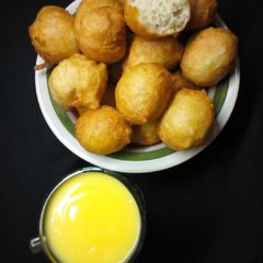 Coconut puff puff and costard A picture of Coconut puff puff and costard.