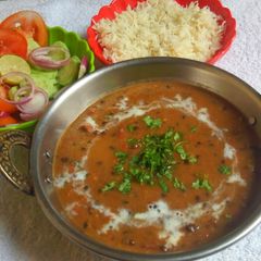 A picture of Dal makhni with rice.