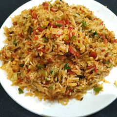A picture of Smoky schezwan Fried Rice.