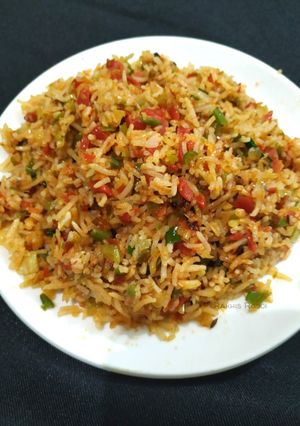 A picture of Smoky schezwan Fried Rice.