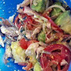 A picture of Avocado on green  salad.