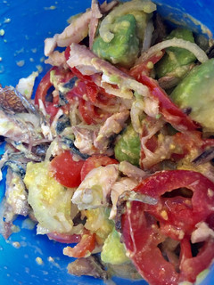 A picture of Avocado on green  salad.