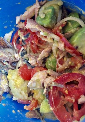 A picture of Avocado on green  salad.