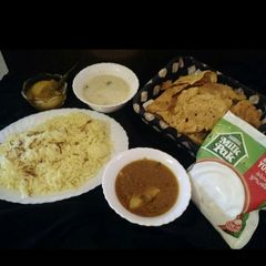 A picture of Kadi khichri and aloo qeema.