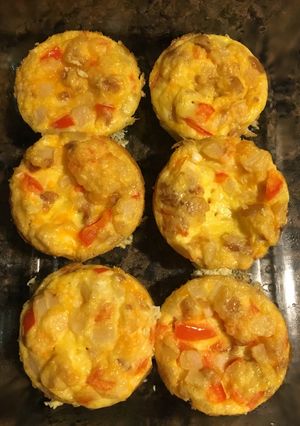 A picture of Scrambled eggs in a Muffin Tin.
