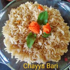 A picture of Brown Rice with lemongrass stem,basil leaves.