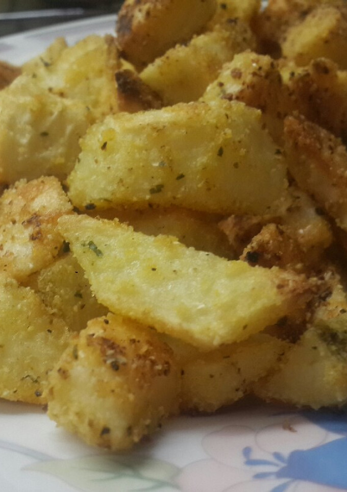 Una foto de Papas al horno crocantes rebozadas con polenta🍠🌽