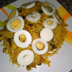 Spaghetti joloff with boiled egg A picture of Spaghetti joloff with boiled egg.