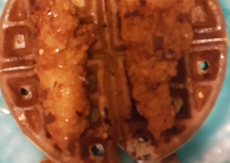 Chicken and waffles with red chili flake and honey