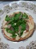 Pizzetas con jamón crudo y rúcula