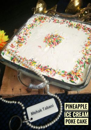 A picture of Pineapple Ice-cream Poke Cake.