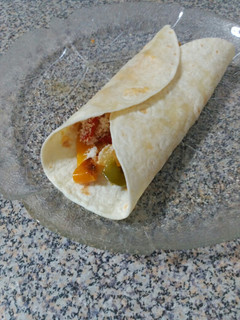 Una foto de Fajitas de pollo con pimientos y queso
