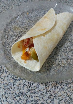 Una foto de Fajitas de pollo con pimientos y queso