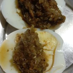 A picture of Boiled egg with pudina chutney.