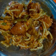 A picture of Hakka noodles with gravy.