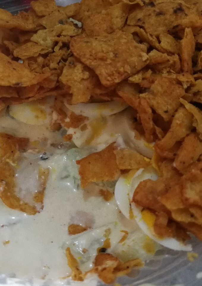 A picture of Cucumber, egg and chip salad.