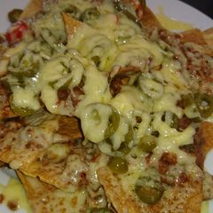 Nachos With Salsa, Jalapeño Peppers & Cheese A picture of Nachos With Salsa, Jalapeño Peppers & Cheese.