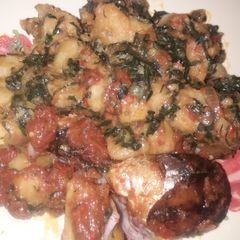 A picture of Yam porridge with fried fish.