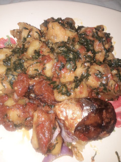 A picture of Yam porridge with fried fish.