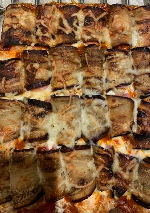 Una foto de Berenjenas con jamón y queso