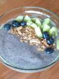Blueberry-Banana-Spinach Smoothie topped with granola and fruits