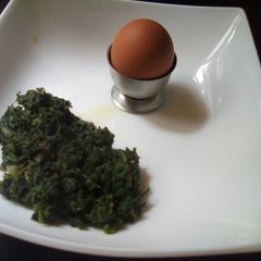 Fried pumpkin leaves and boiled egg A picture of Fried pumpkin leaves and boiled egg.
