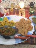 Combo of dhokla aloo paratha chole and tikki