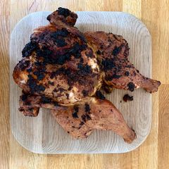 A picture of Blackened spatchcock chicken on the braai.