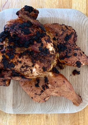 A picture of Blackened spatchcock chicken on the braai.