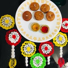 A picture of Ghila Pitha / Tel Pitha : RICE FLOUR AND JAGGERY FRITTERS.