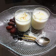 A picture of Saffron badam sharbat with milk.