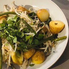 A picture of Charlotte potato, green bean and bean sprout tray bake with peanut, coconut and chilli dressing.
