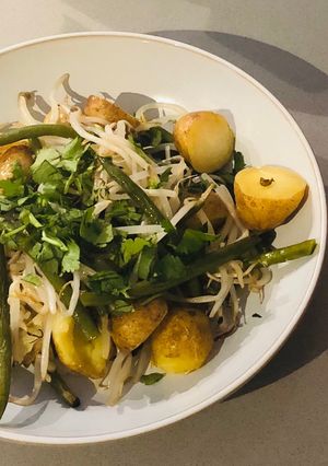 A picture of Charlotte potato, green bean and bean sprout tray bake with peanut, coconut and chilli dressing.