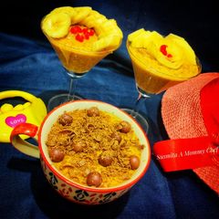 Doodh daliya in pressure cooker (with different toppings) A picture of Doodh daliya in pressure cooker (with different toppings).