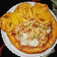 Chicken Malai boti creamy floral pizza in pateela A picture of Chicken Malai boti creamy floral pizza in pateela.