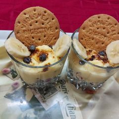 A picture of Layered Fruity Custard with Coconut and Biscuit Parfait.