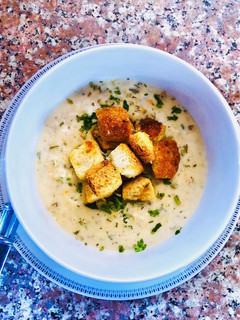 A picture of Cream of mushroom, potato and ham soup with crunchy garlic croutons.