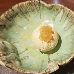 A picture of Avacado Ice-cream topped with Cavier.