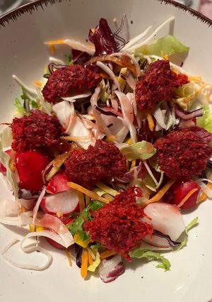 A picture of Salad with Beetroot Patties.