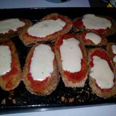 Una foto de Milanesas de berenjena a la napolitana