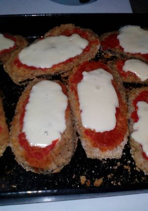 Una foto de Milanesas de berenjena a la napolitana