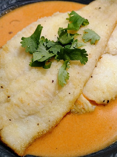 A picture of Pan-seared sole with tomato-coconut sauce.