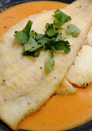 A picture of Pan-seared sole with tomato-coconut sauce.