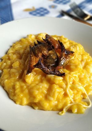 A picture of Pumpkin Risotto with Prosecco and Crispy Skin Chips.