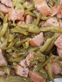 A picture of Green beans and smoked sausage.