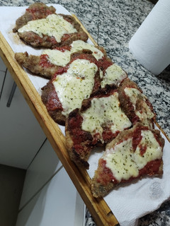 Una foto de Milanesa de carne a la Napolitana