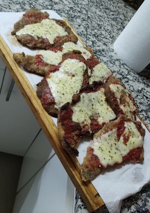 Una foto de Milanesa de carne a la Napolitana